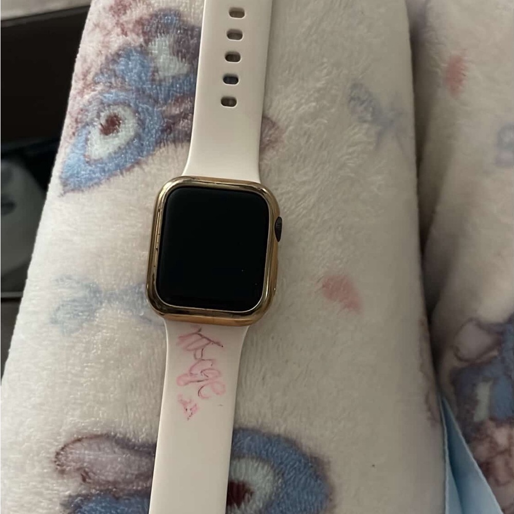 Apple Smartwatch with Gold Case and White Band